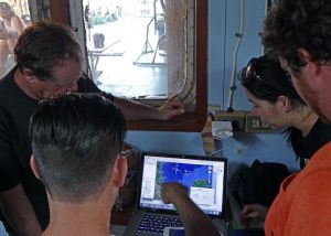 Chief-scientist David Hollander and researcher Isabel Romero discuss R/V Justo Sierra’s anticipated path through the Gulf of Mexico. (Provided by C-IMAGE)