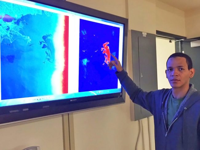 GraberScholar_JuanPinalesPresen-WEB Juan demonstrates Synthetic Aperture Radar (SAR) data from the Deepwater Horizon incident. (Provided by Juan Pinales)