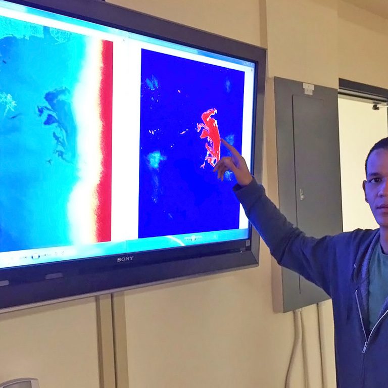 GraberScholar_JuanPinalesPresen-WEB Juan demonstrates Synthetic Aperture Radar (SAR) data from the Deepwater Horizon incident. (Provided by Juan Pinales)