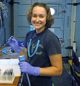 Kelsey Rogers collects samples of sediment particles onboard the R/V Endeavor’s laboratory. (Photo provided by Professor Joseph Montoya, Georgia Institute of Technology)