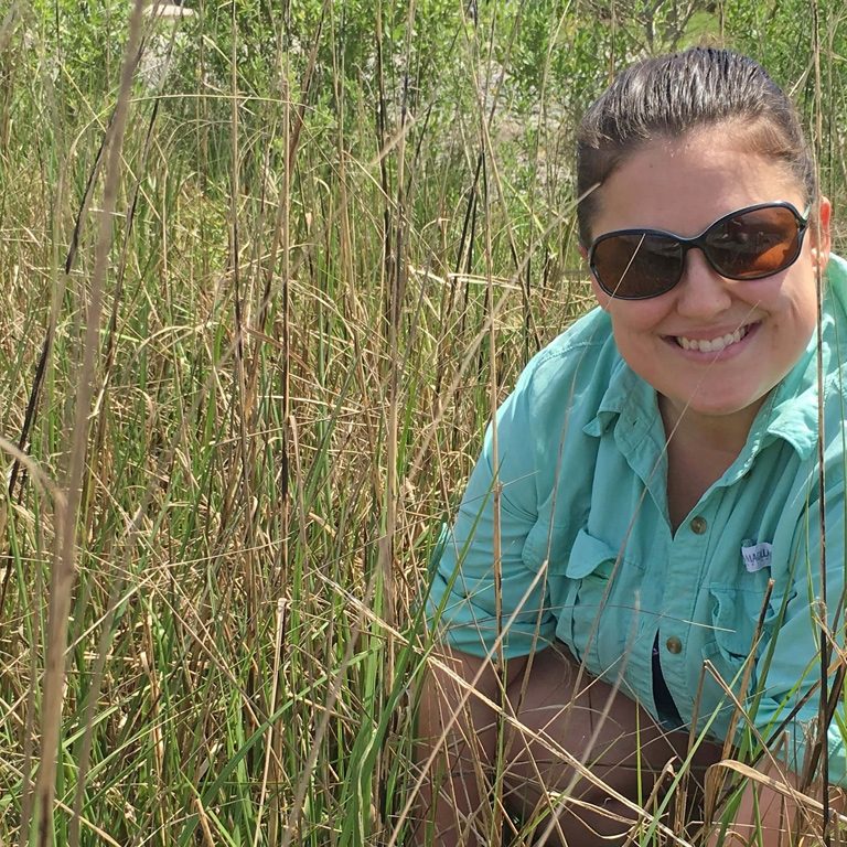 Elizabeth Robinson enjoys field work in Terrebone Bay studying blue crab in their natural habitat. (Photo provided by E. Robinson)