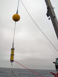The bosun of the R/V Atlantis (bottom right) indicates that the acoustic scintillation receiver mooring is clear to be lowered into the water. Di Iorio’s team will use this instrumentation to monitor the hydrocarbon plume. (Photo by Daniela Di Iorio)