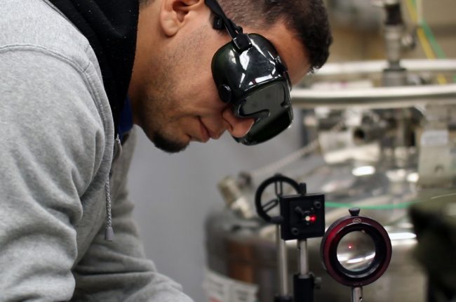 Bassam Alfarhani aligns the laser beam of the multidimensional luminescence system. (Provided by Andres Campiglia)