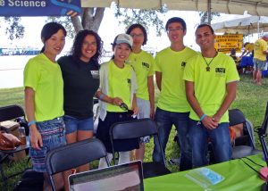 Shaojie (right 2nd) and other USF College of Marine Science students share their research about Ocean Color with the public at the St. Petersburg Science Festival. (Photo by Chuanmin Hu)