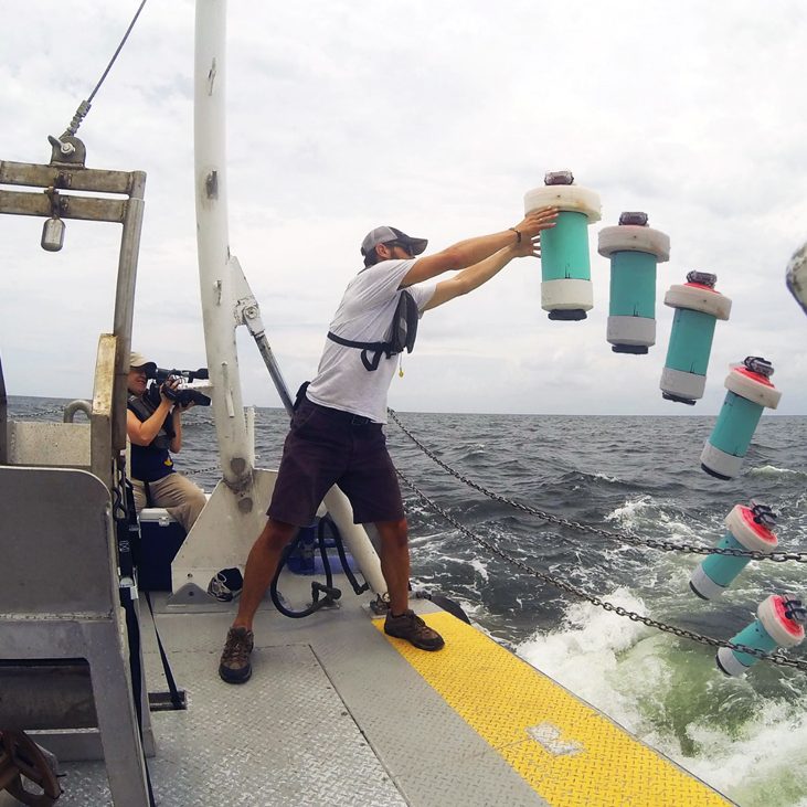 Drifters-deployment-WEB A researcher conducts surface drifter deployment, July 2013. (Photo credit: CARTHE Consortium)