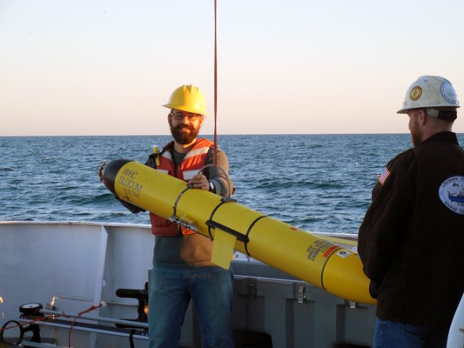Adam Boyette retrieves a glider on the deck of the R/V Point Sur, where he served as chief scientist on the three-day cruise examining the impacts of the Bonnet Carré spillway opening. (Photo by Alison Deary)