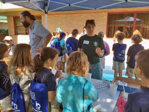 Adam and fellow graduate student Naomi Yoder teach Pontchartrain Elementary students about nearshore ecology during an Earth Science Day event. (Photo by Stephanie Watson)