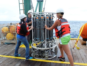 IMG_5442_slider Senior research associate Jodi Brewster (left) and Ph.D. candidate Johna Rudzin (right) deploying a CTD with Nanson bottles off the University of Miami R/V F. G. Walton Smith, a ship in the University-National Oceanographic Laboratory System fleet. (Photo by Jodi Brewster).