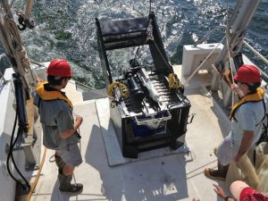 Co-authors John Ransom (former GoMRI Scholar) and Dr. Jesse Filbrun (former GoMRI postdoc) prepare to deploy the BIONESS plankton sampler. (credit: USM Fisheries Oceanography and Ecology Lab)