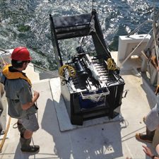 Co-authors John Ransom (former GoMRI Scholar) and Dr. Jesse Filbrun (former GoMRI postdoc) prepare to deploy the BIONESS plankton sampler. (credit: USM Fisheries Oceanography and Ecology Lab)