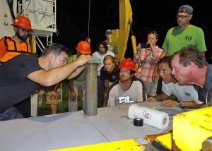 Patrick Schwing and the research crew aboard the RV Justo Sierra prepare a sediment core from the southern Gulf of Mexico for analyses. Photo Credit: Devon Firesinger 2015