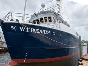 20170523 r_v hogarth launch 072_slider The W.T. Hogarth is lowered into the water for the first time. Photo by Eric Younghans, University of South Florida Health Communications