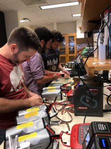 The drone team prepares batteries as many back ups are needed to reload and relaunch drones for continuous imagery of drift card distribution. Photo provided by CARTHE