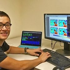 Shitao generates a visualization comparing satellite observational data to model simulations. (Photo by Suzhe Guan)