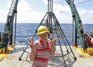 Melissa stands next to the multi-corer used to collect sediment samples. (Photo by Ben Prueitt)