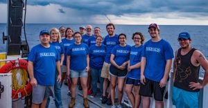 Researchers aboard the R/V Point Sur pose in front of a large waterspout during a summer 2015 research cruise. (Provided by DEEPEND)