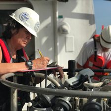NancyRabalais_HypoxiaStudy_slider Study author Nancy Rabalais records information as they collect water samples to monitor the hypoxic zone. Photo provided by Rabalais.