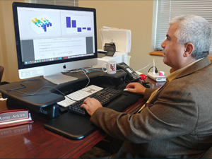AzmyAckleh_LADC-GEMM_slider Study author Azmy Ackleh works with a modified population matrix model to see how an environmental disturbance can affect large marine mammal recovery. Provided by Azmy Ackleh.