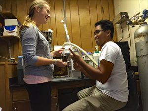 Meredith and Hernando pyrolysis_slider Meredith Evans Seeley and Dr. Hernando Bacosa maintain the Py-GC-MS machine. (Provided by Meredith Evans)