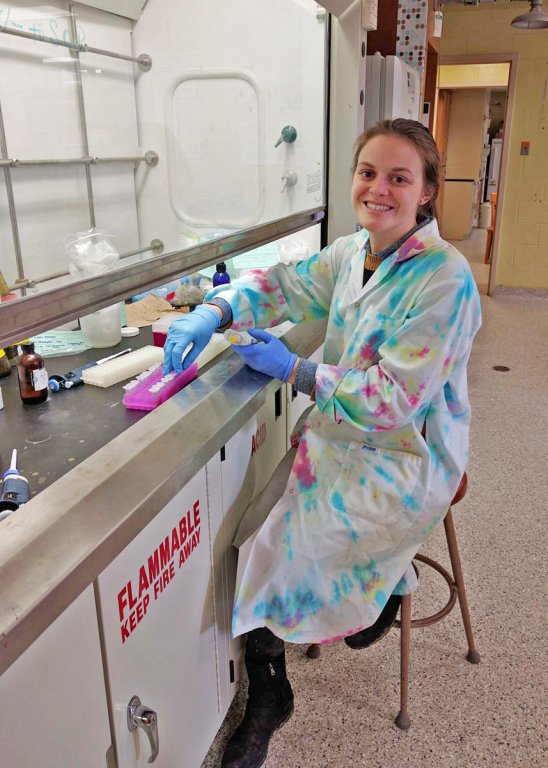 Samantha “Sam” Setta conducts DNA extractions with help from collaborators on the ADDOMEx team at Mount Allison University in Canada. (Photo by Laura Bretherton)