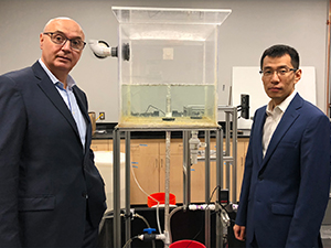 Michel Boufadel and Feng Gao with a scaled reproduction of an underwater plume. (Provided by Michel Boufadel)