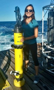 Luna Hiron holds an Autonomous Profiling Explorer (APEX) float aboard the R/V Walton Smith for deployment in the Gulf of Mexico. (Provided by Luna Hiron)