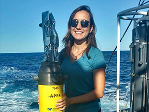Fig1_slider Luna Hiron holds an Autonomous Profiling Explorer (APEX) float aboard the R/V Walton Smith for deployment in the Gulf of Mexico. (Provided by Luna Hiron)