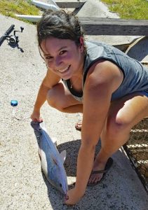 Alexis measures a red drum for her study. (Provided by Alexis Khursigara)