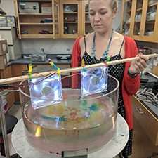 Jenna conducts a rotating tank experiment to illustrate Ekman dynamics for the Summer@Brown course “Studying the Ocean from Blackboards to Drones.” (Photo by Abigail Bodner)