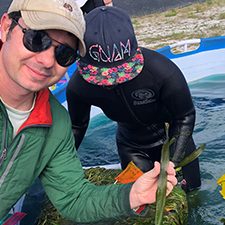 Pub_CWC_Martin_IMG_1802_slider Study author Charlie Martin assists with a recent experiment on submerged aquatic vegetation. Photo provided by Charlie Martin