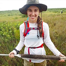 Scholar_Bociu_1_slider Ioana Bociu holds a salt marsh core while conducting research at the Florida Fish and Wildlife Research Institute. (Photo credit: Dr. Ryan Moyer)