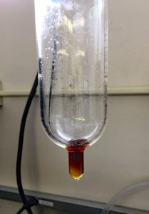 A lab vial containing an aggregate sample after being concentrated to 1 mL for GC-MS analysis. (Provided by Ioana Bociu)
