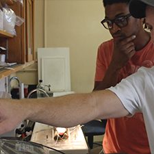 Dane Crossley_slider University of North Texas Associate Professor of Biology Dane Crossley (white shirt) and his graduate student Derek Nelson (a GoMRI Scholar) review cardiovascular data of oil-exposed early-life-stage fish. Credit Daniel DiNicola RECOVER consortium.