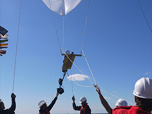 CARTHE researchers launch the Ship Tethered Aerostat Remote Sensing System (STARSS) from the M/V Masco VIII during the Lagrangian Submesoscale Experiment (LASER). STARSS was part of a large-scale oceanographic campaign designed to observe oceanic dispersion over a wide range of spatial and temporal scales and understand transport and dispersion of oil and other buoyant materials. Left to right: Jean Mensa, Guillaume Novelli, undergraduate student Mike, Daniel Carlson, and Cedric Guigand. Photo credit: Maristella Berta (National Research Council-Institute of Marine Science, CNR-ISMAR, Venice, Italy).
