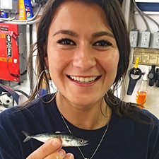 Nina Pruzinsky holds a juvenile little tunny (Euthynnus alletteratus) that she identified on the DEEPEND DP06 cruise. (Photo by Natalie Slayden)