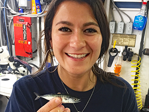 DEEPEND_Scholar_Pruzinsky1_slider Nina Pruzinsky holds a juvenile little tunny (Euthynnus alletteratus) that she identified on the DEEPEND DP06 cruise. (Photo by Natalie Slayden)