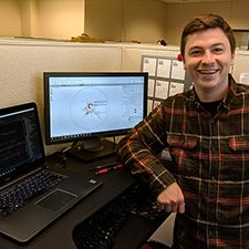 Ph.D. student Joe Sevigny conducts bioinformatics analyses at the University of New Hampshire Hubbard Center for Genome Studies. (Photo by Steve Simpson)