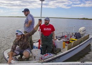 The marsh work group returns after a long day of field work. (L-R) Research assistant Mike Becker and master’s students Patrick Rayle and Ben Aker. (Photo by Claudia Husseneder)