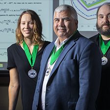 ULL team award_slider From left, Dr. Amy Veprauskas, Dr. Azmy S. Ackleh, and Dr. Ross Chiquet, recipients of the 2019 Rollie Lamberson Research Award. Not pictured are Dr. Tingting Tang and Dr. Hal Caswell. (Photo credit: Doug Dugas, University of Louisiana at Lafayette photographer, used with permission from Doug Dugas)