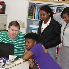 LADC-GEMM_Leftwich_Easton group_slider Study author and physics instructor Kendal Leftwich (L) discusses marine mammal acoustic data with students from Warren Easton Charter High School in New Orleans, Louisiana. Photo provided by Kendal Leftwich.