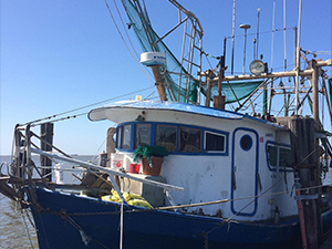 A fishing boat docked in Buras, Louisiana. Photo credit Vanessa Parks