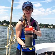 CSOMIO_Scholar_Tarpley1_slider Virginia Institute of Marine Science Ph.D. student Danielle Tarpley holds a sediment core collected from the Lynnhaven River in Virginia. (Photo courtesy of Jessica Turner)