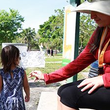 University of Texas Health Science Center Ph.D. student Tanu Altomare works with a child participant in the Beach Exposure And Child HEalth Study (BEACHES) project. (Photo by Helena Solo-Gabriele)