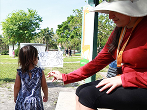 RFP-VI Solo-Gabriele_Scholar_Altomare1_slider University of Texas Health Science Center Ph.D. student Tanu Altomare works with a child participant in the Beach Exposure And Child HEalth Study (BEACHES) project. (Photo by Helena Solo-Gabriele)