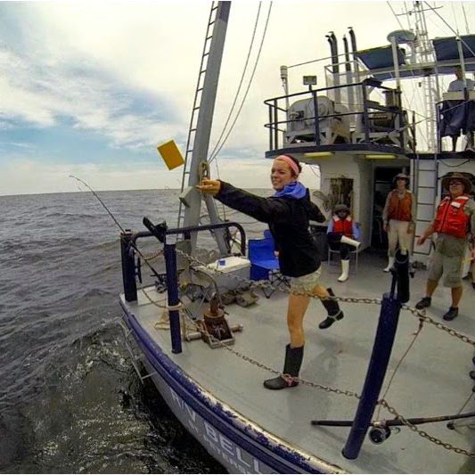 DriftCards_KV_Part2 Deep-C summer intern and University of West Florida student Katie Vaccaro throws out a drift card on her Gulf research cruise with Dr. Richard Snyder. Photo Credit: Deep-C.