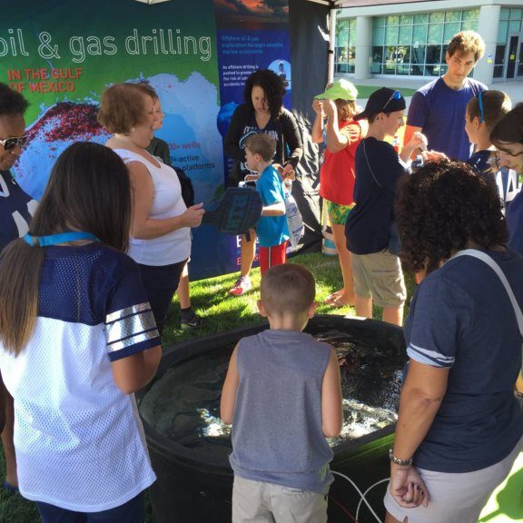 Visitors check out the ROV tank at the Ocean Discovery Zone exhibit at the Penn State vs Kent State Football game in September. Photo Credit: ECOGIG.