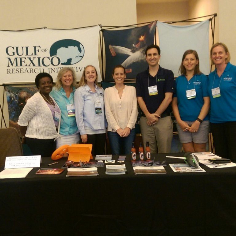NMEA 1 – Credit Katie Fillingham GoMRI hosted a booth at the 2016 NMEA conference. From left to right: Angela Lodge, Teresa Greely, Katie Fillingham, Laura Bracken, Dan DiNicola, Emily Davenport, and Sara Beresford. Not pictured: Sherryl Gilbert and Ben Prueitt. Photo Credit: Katie Fillingham