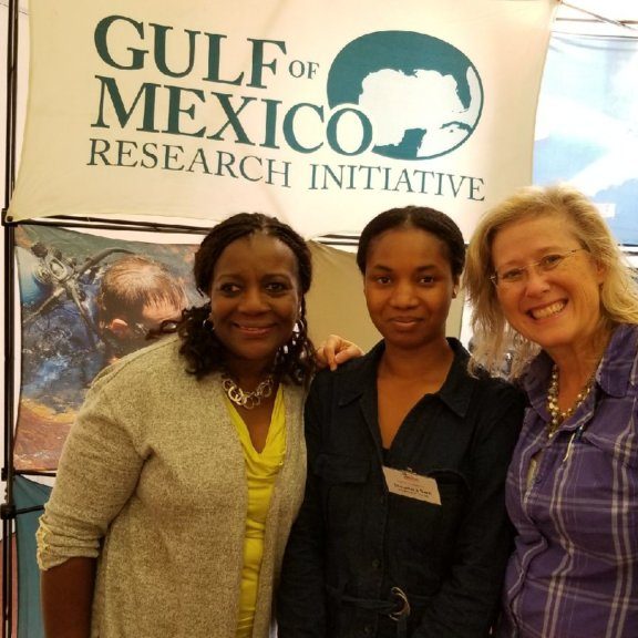 Resized_125749_7691_1507900414159 (1) C-IMAGE outreach coordinators Teresa Greely (right) and Angela Lodge (left) with graduate student Theodora Sam from Guana at EMSEA. Photo Credit: Teresa Greely.