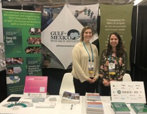 Callan Yanoff (left, GoMRI Management Team) and Rosalie Rossi (right, GRIIDC Program Manager) at the GoMRI/GRIIDC booth at the 2019 AGU Fall Meeting in San Francisco, California. . Photo Credit: Leigh Zimmermann